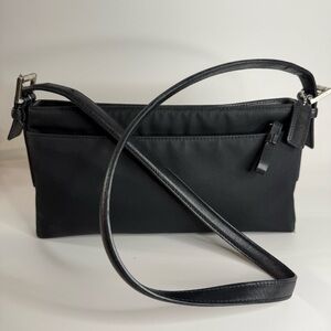 Coach Black Bag with Adjustable Strap and Minimalist Design